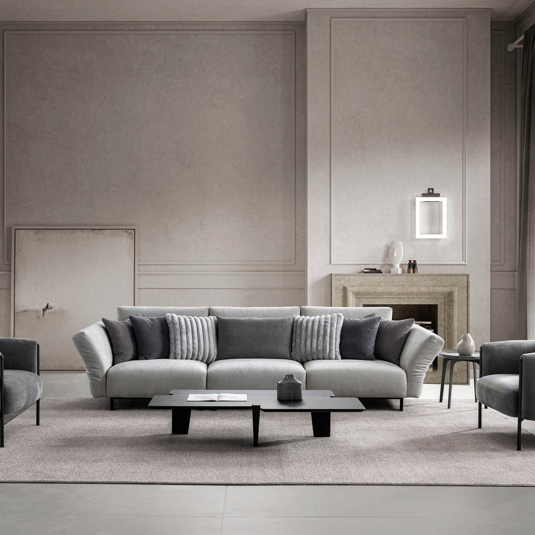 Loft Home 4-seater modern sofa in sleek gray tones, complemented by plush cushions, creating a luxurious and contemporary living room aesthetic.
