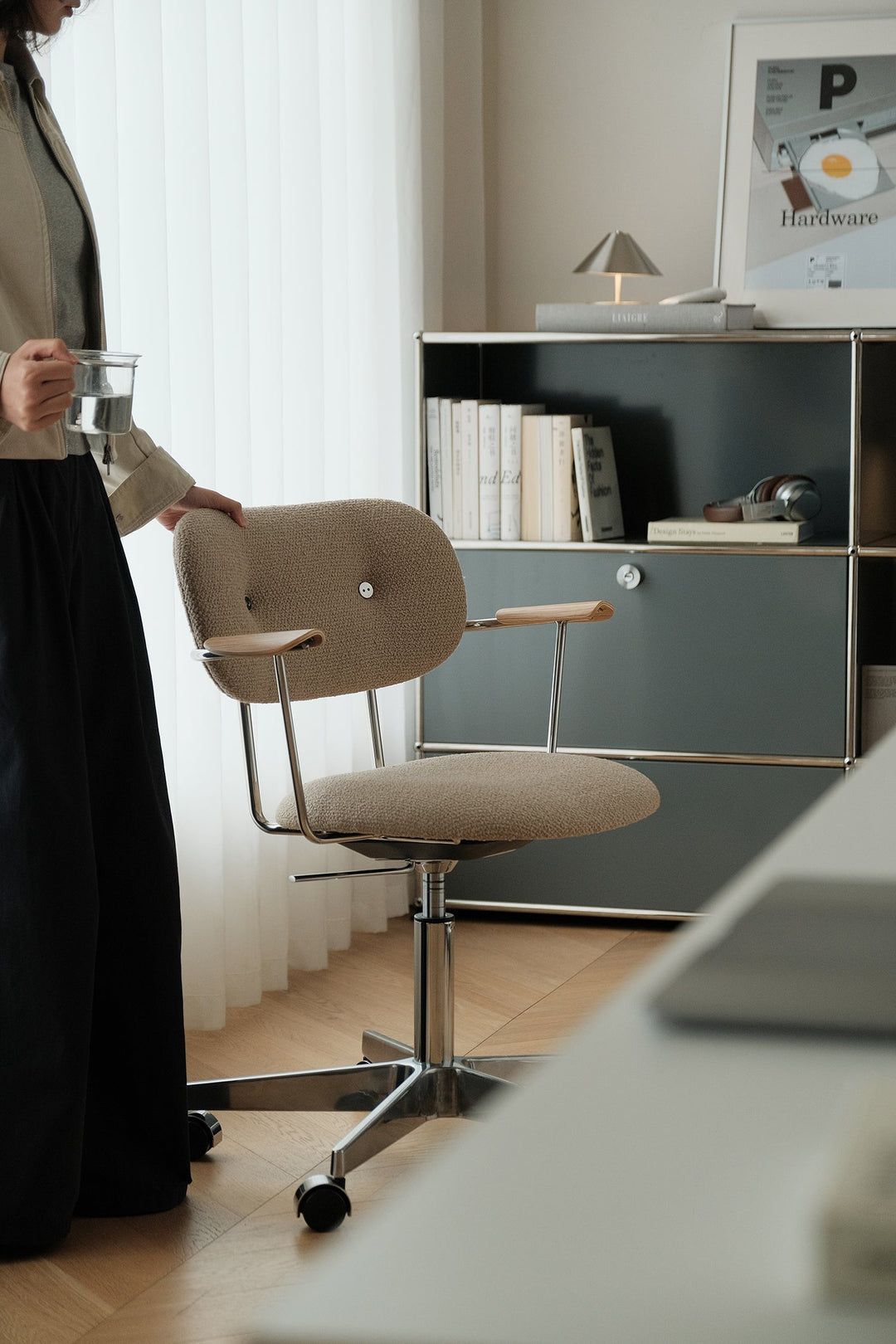 Bauhaus-inspired chair with curved wood arms and upholstered seat, styled for US home offices, apartments, and modern interiors.