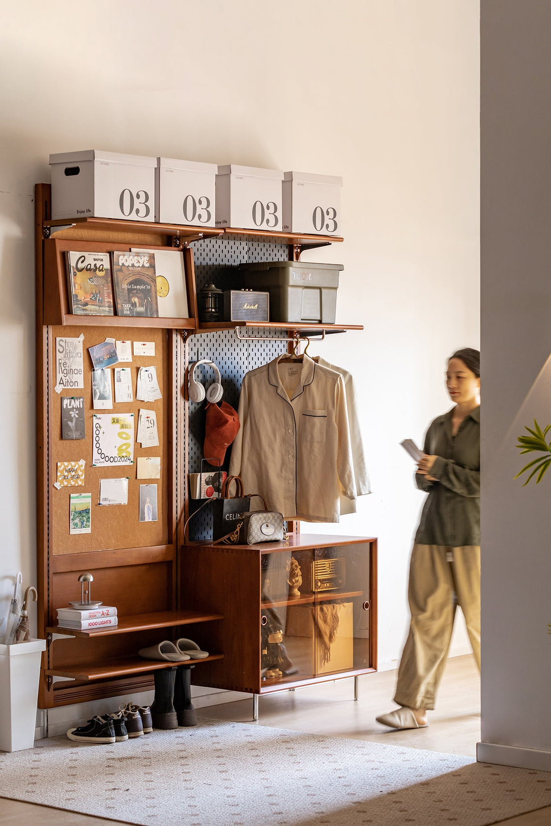 Bauhaus-style multifunctional storage unit with open shelves, pegboard, and glass cabinet, blending modern organization and vintage charm in a stylish entryway.