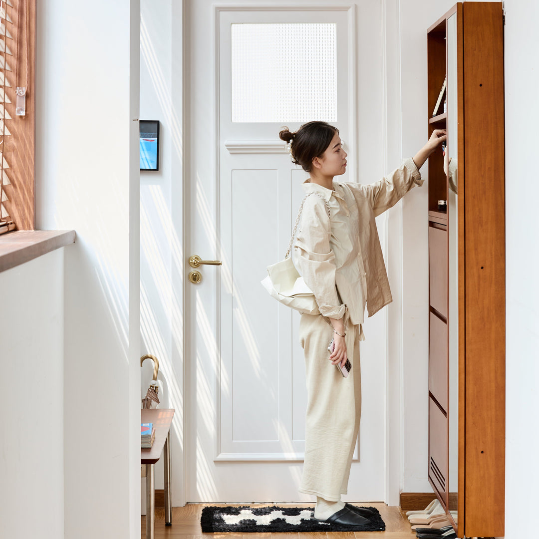 Loft Home rustic wooden console table with vintage decor, candles, and a sunburst mirror, creating a cozy and stylish entrance or living space.