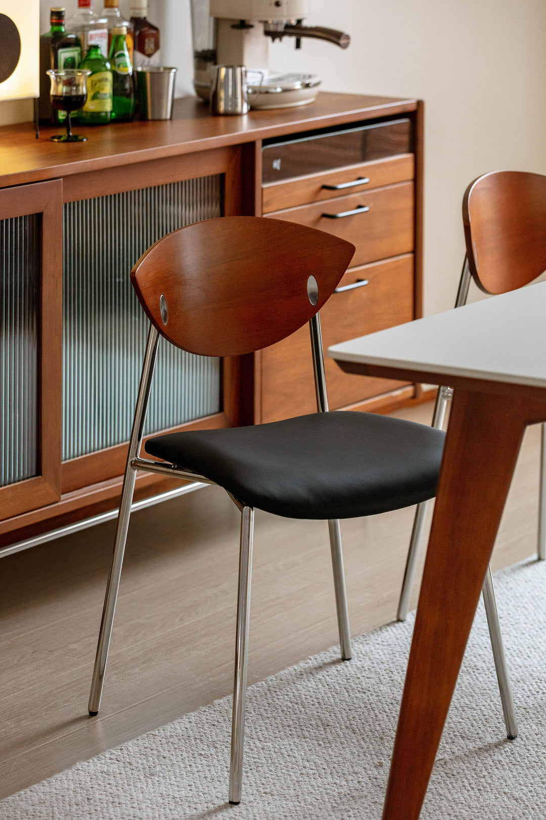 PU leather dining chair with wooden back and metal legs, styled for US dining rooms, apartments, breakfast areas, and modern homes.