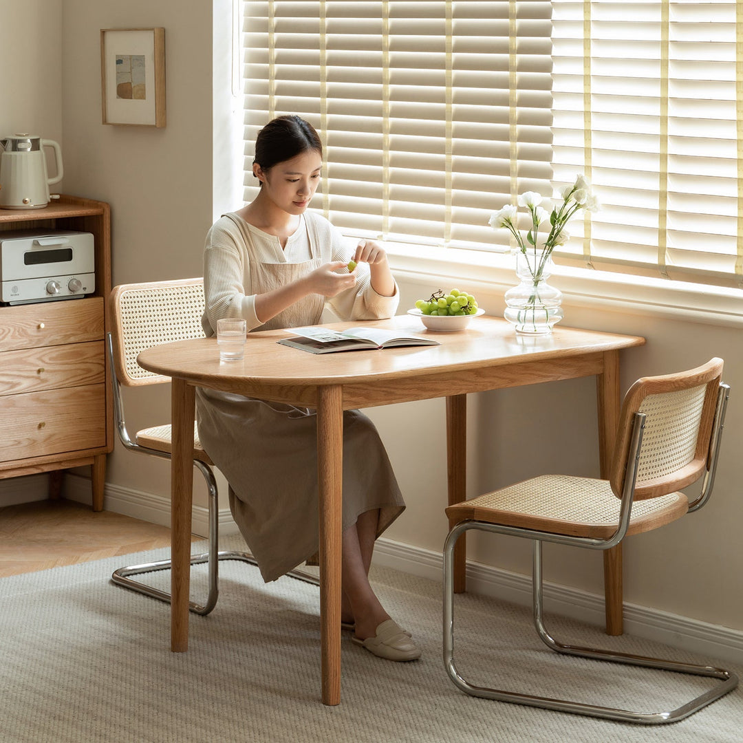 LOFT HOME 2-4 Seater Dining Table Collection - Minimalist oak wood dining table paired with rattan-backed chairs, ideal for cozy dining spaces and intimate gatherings.