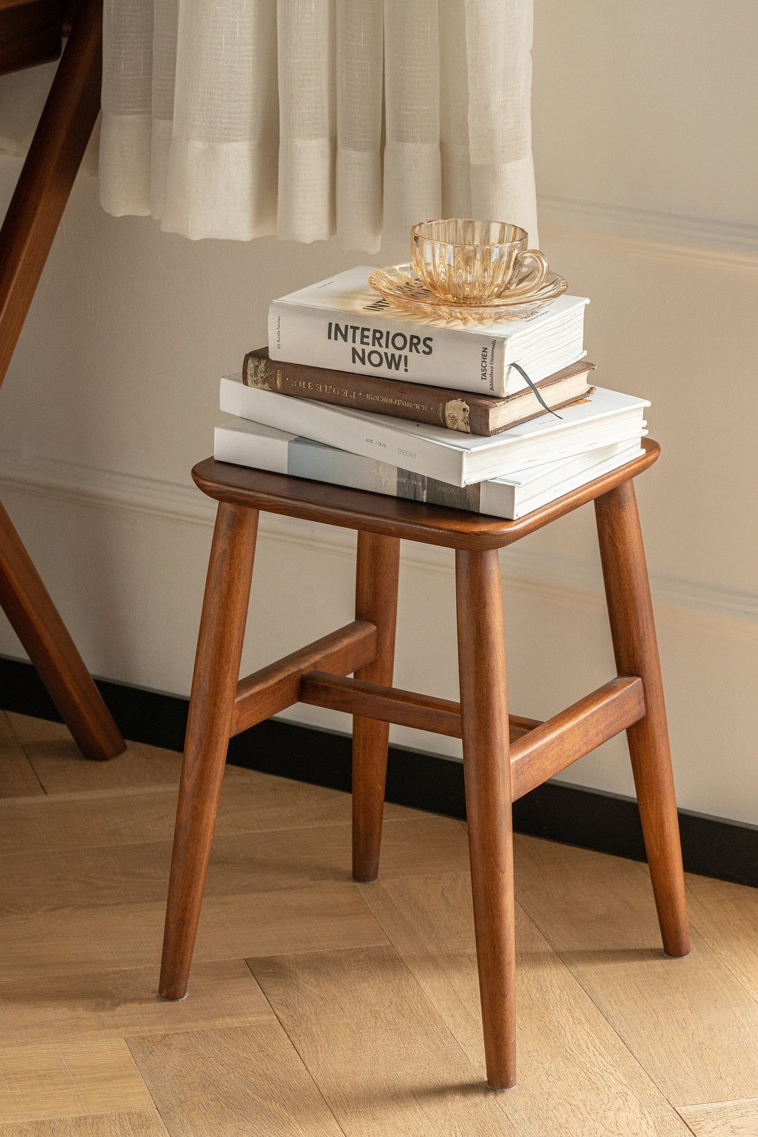 Small wooden stool up to 20 inches, styled for compact seating, bedside use, and cozy corners in US apartments and bedrooms.