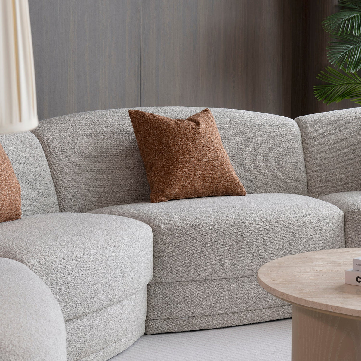 Modern boucle fabric modular sectional 4 seater sofa curva in real life style.