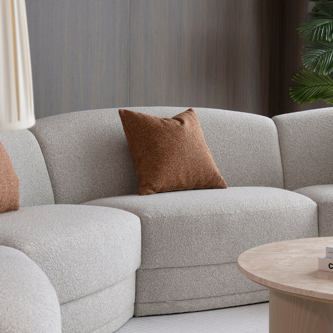 Modern boucle fabric modular sectional 5 seater sofa curva in real life style.