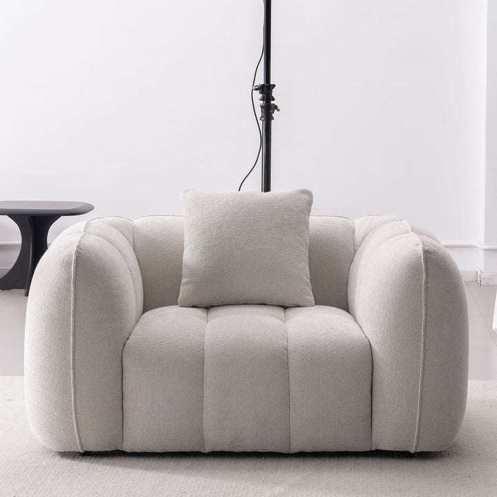 Cream mixed weave fabric 1 seater sofa puddy in real life style.