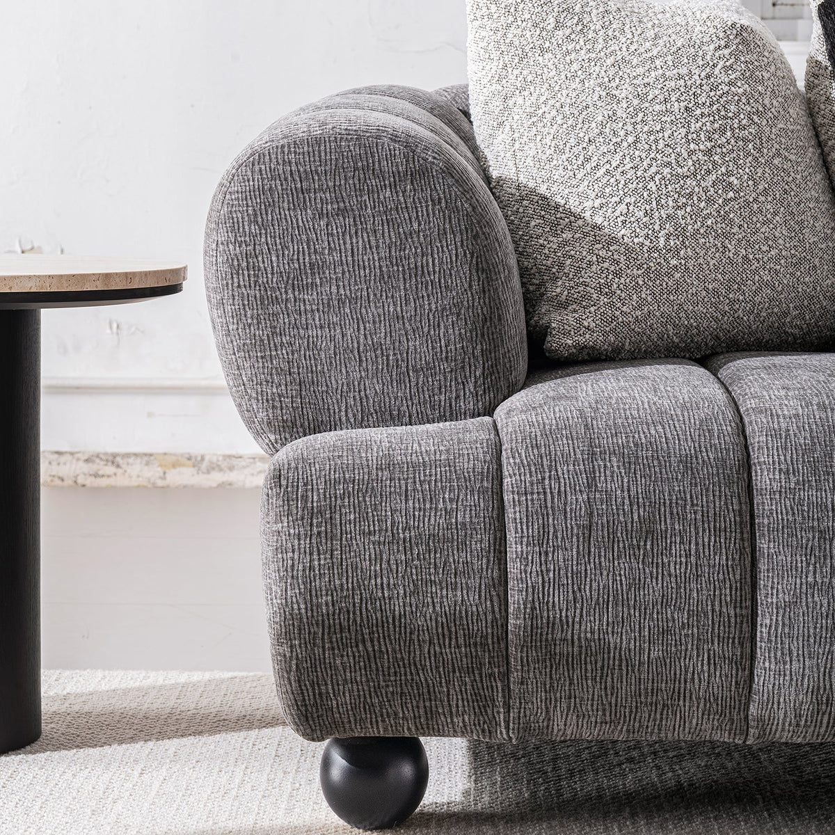 Modern velvet fabric 2 seater sofa raven with context.