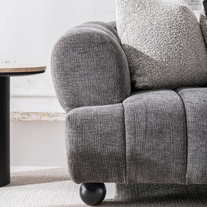 Modern velvet fabric 2 seater sofa raven with context.