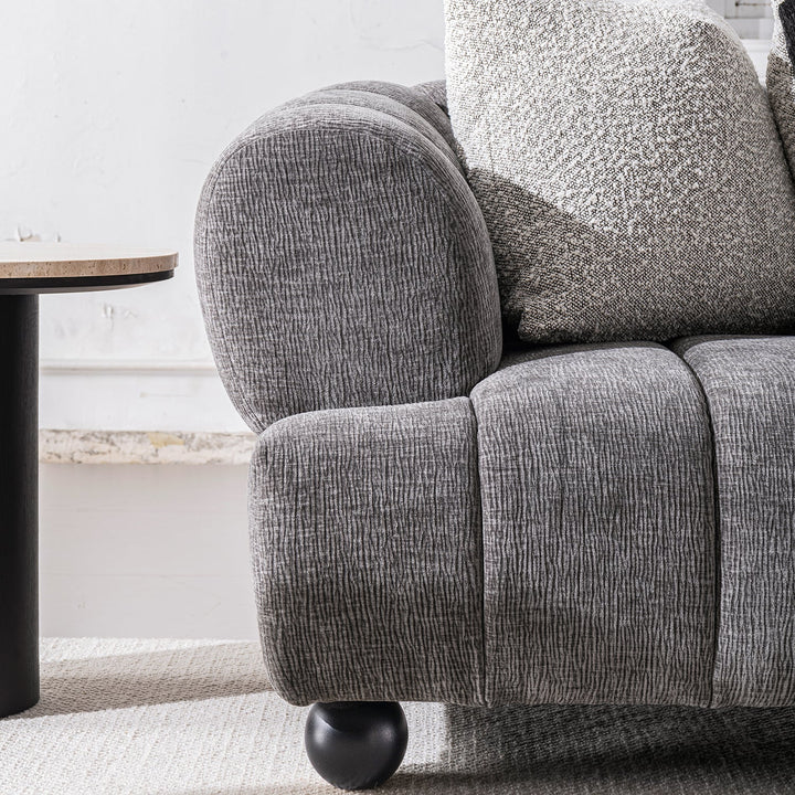 Modern velvet fabric 2 seater sofa raven with context.