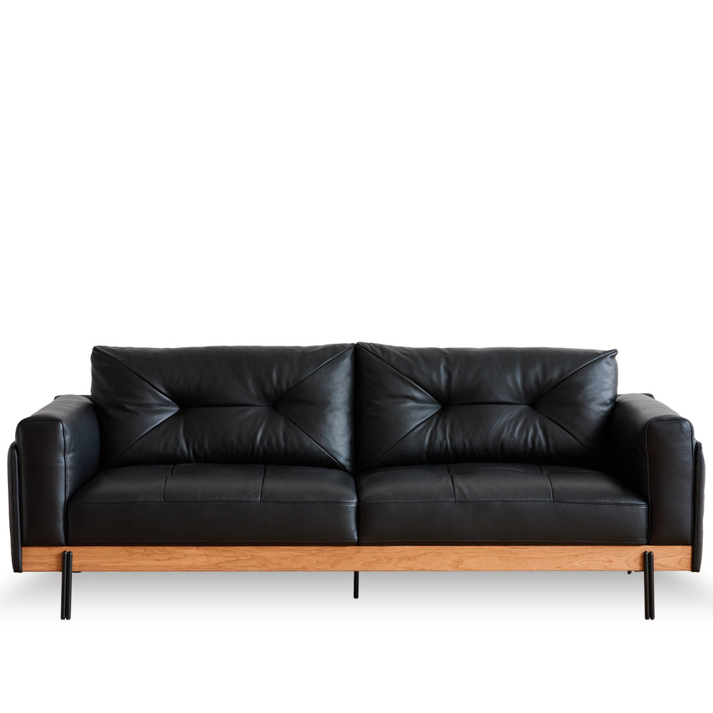 Bauhaus microfiber leather 3 seater sofa black in white background.