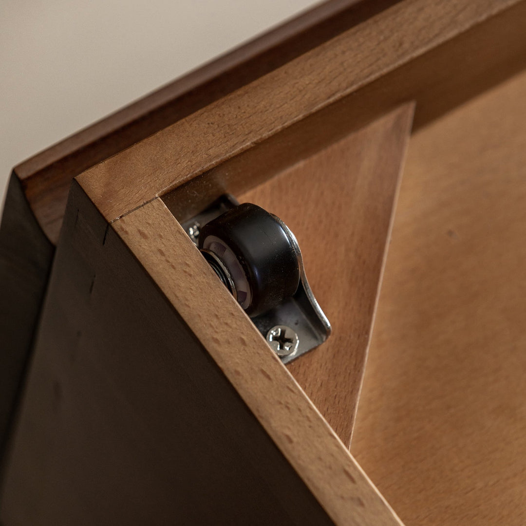 Vintage walnut wood lift-up storage platform bed with drawer kangaroo in close up details.