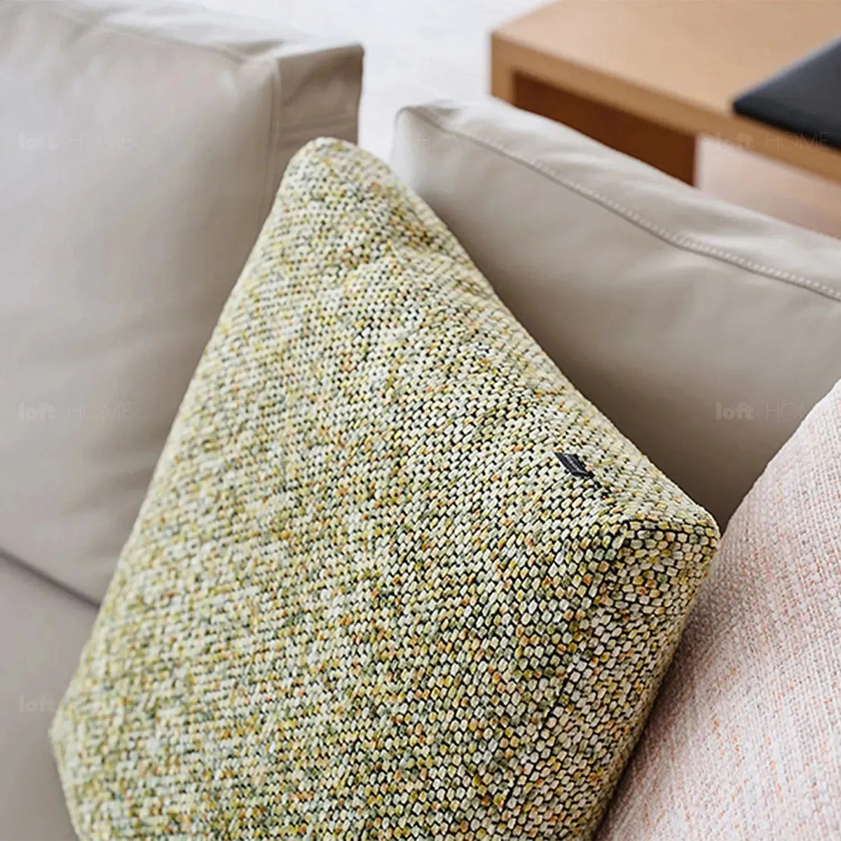 Modern fabric sofa pillow summer green with context.