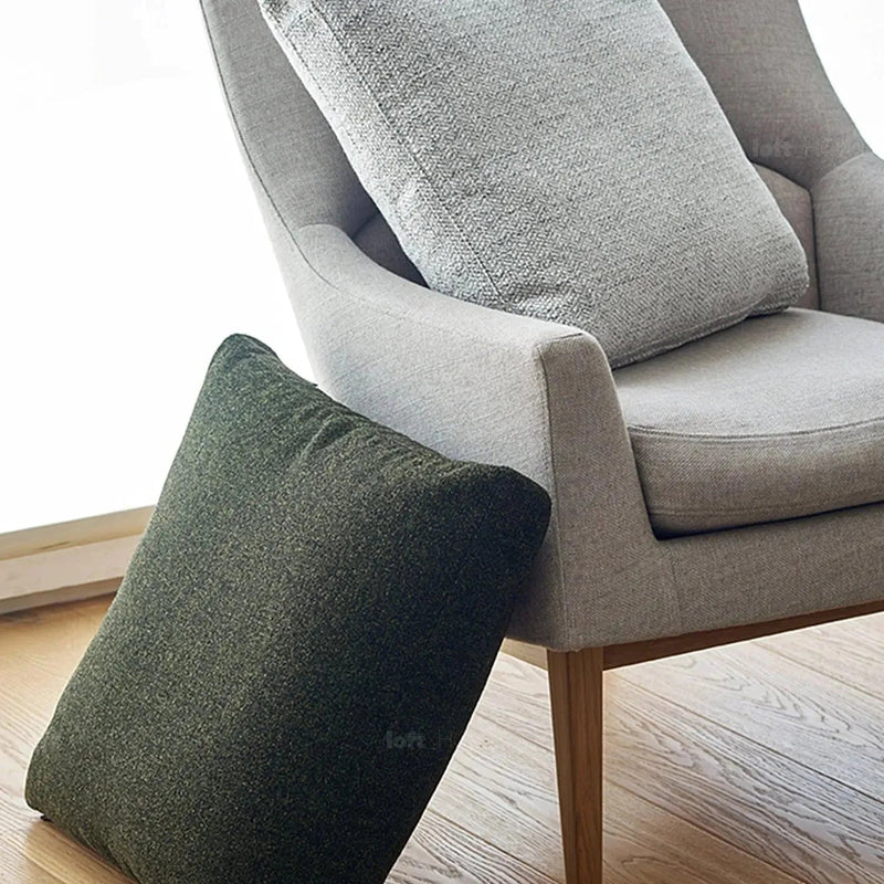 Minimalist fabric sofa pillow nor white in real life style.