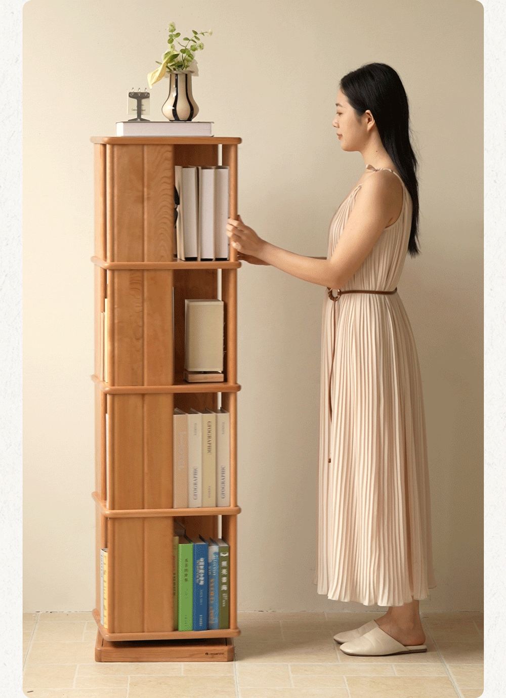 Scandinavian cherry wood revolving bookshelf rotterdam in real life style.