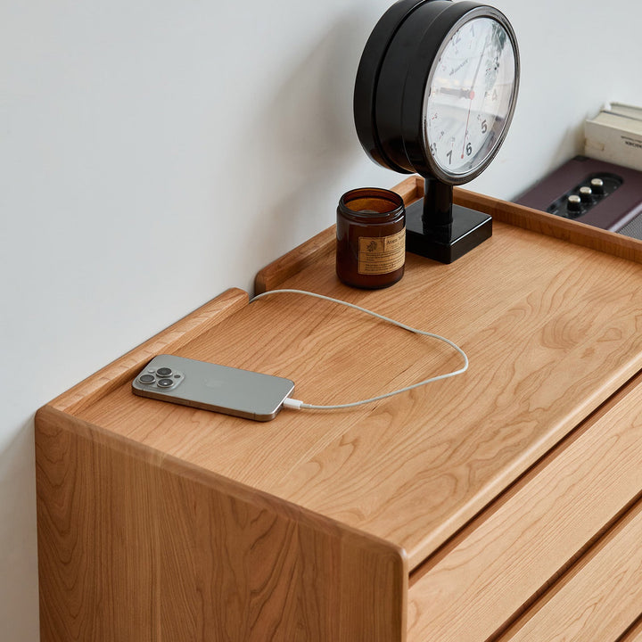 Scandinavian cherry wood chest of drawers vista with context.