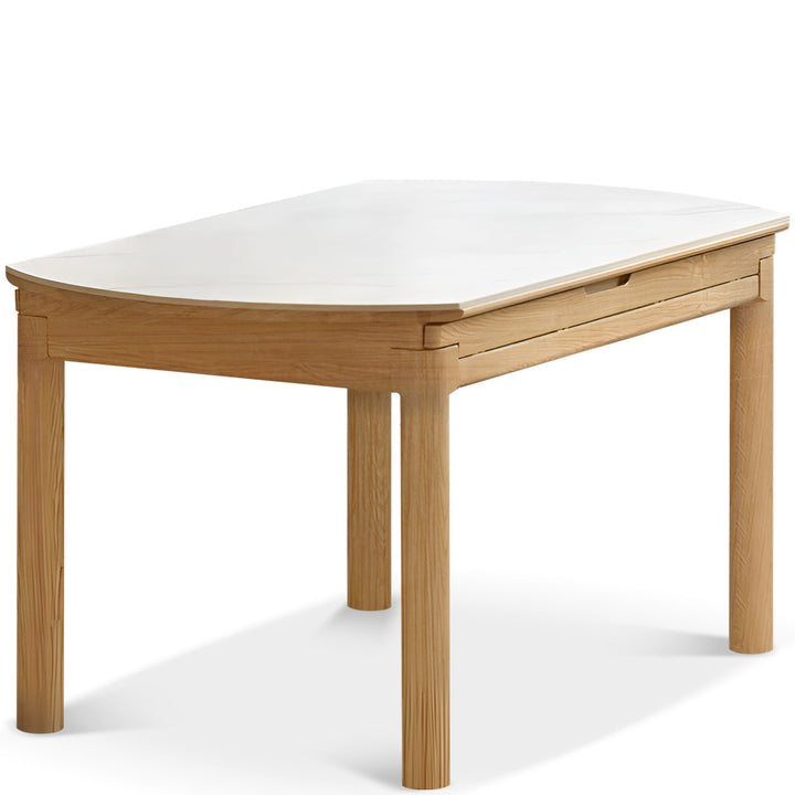 Scandinavian oak wood sintered stone extendable round dining table orbit in white background.