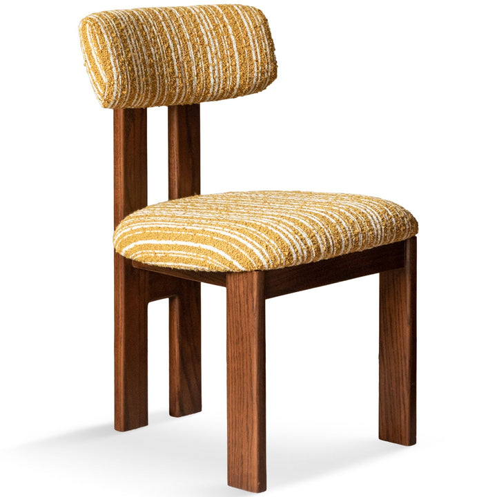 Bauhaus boucle fabric dining chair roma in white background.