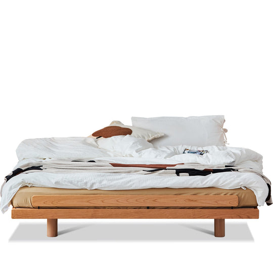 Scandinavian cherry wood platform bed small in white background.