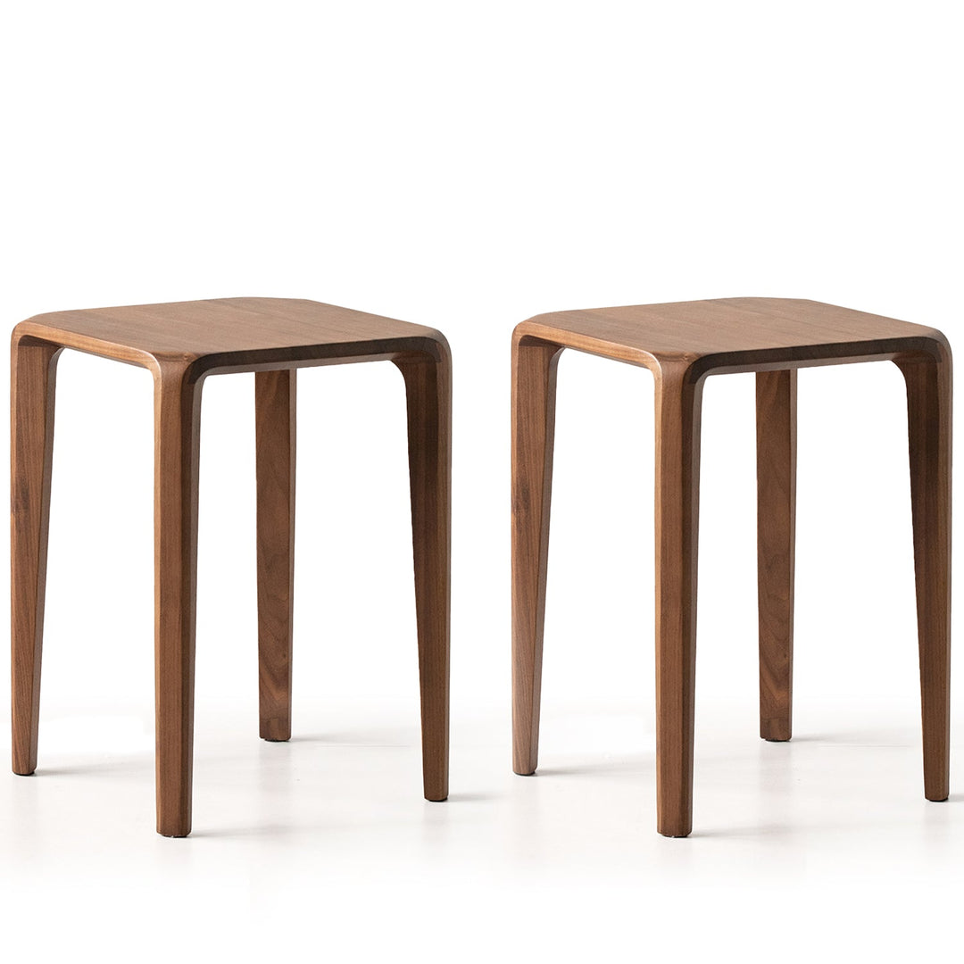 Two wooden side tables on a white background