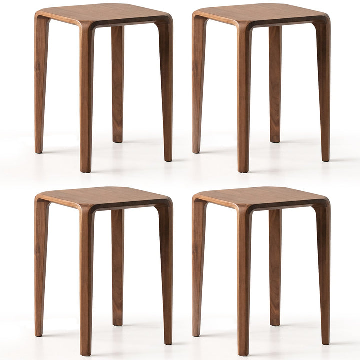 Four wooden stools on a white background