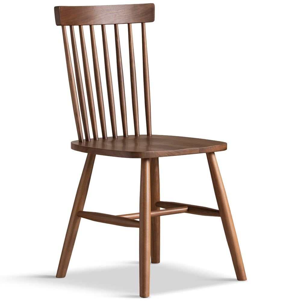Vintage walnut wood dining chair windsor in white background.