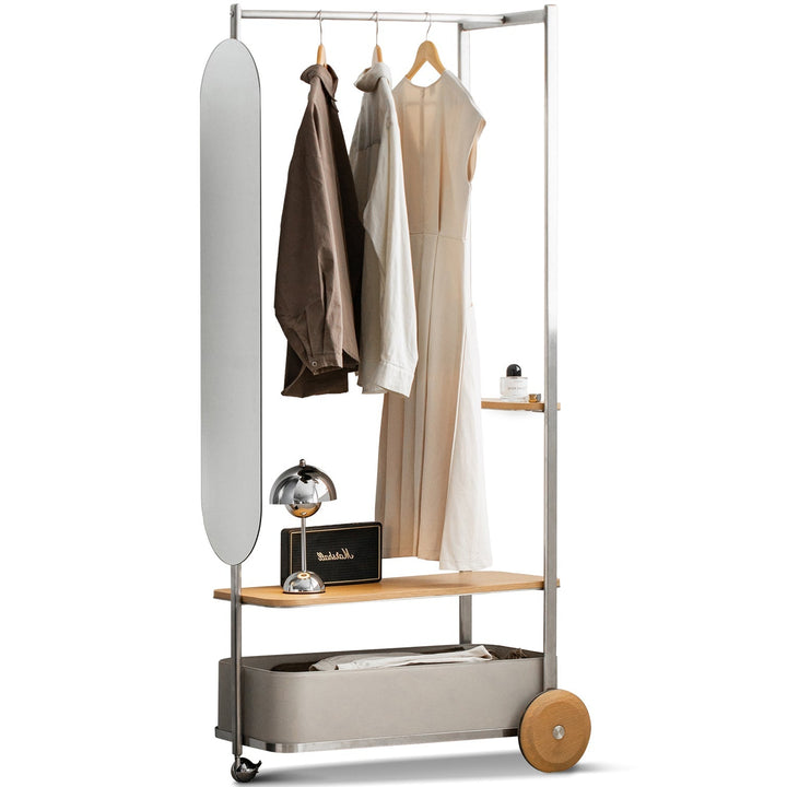 Clothing rack with clothes and a mirror on a white background