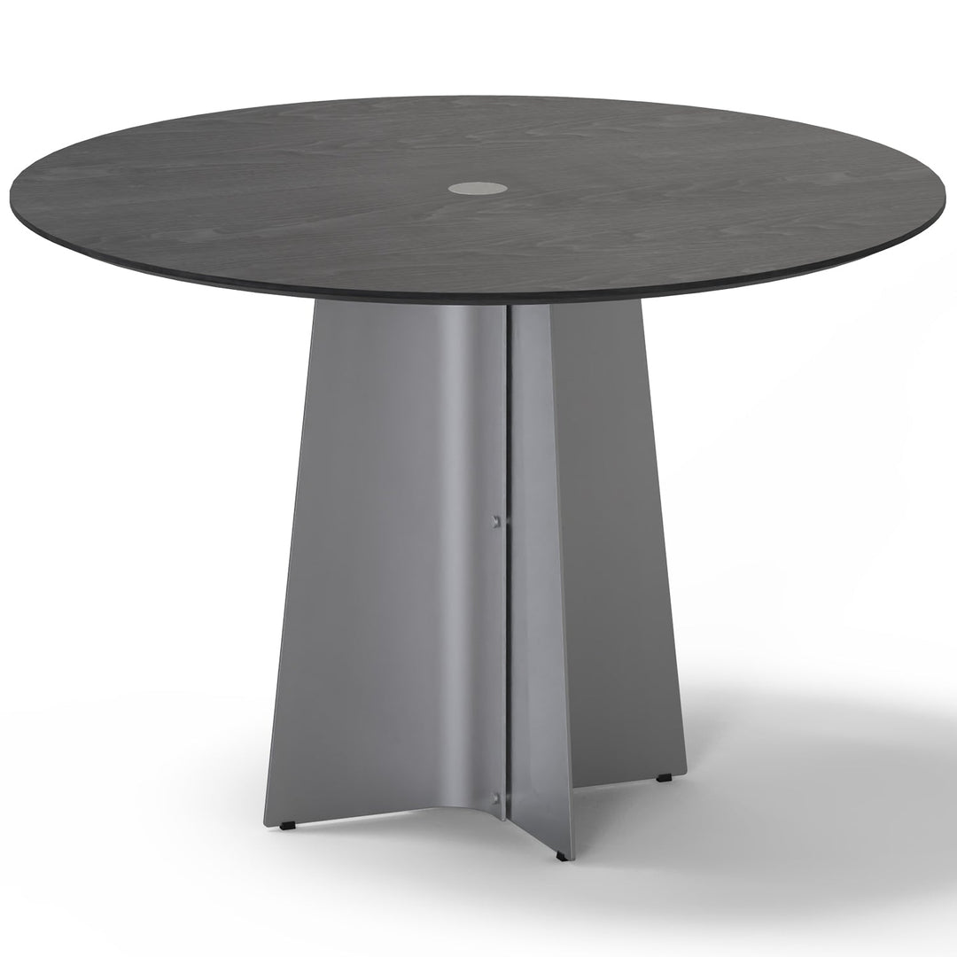 Minimalist ash wood veneer stainless steel round dining table black aeri in white background.