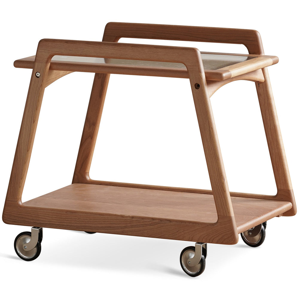 Scandinavian cherry wood wheeled trolley side table yoyo in white background.