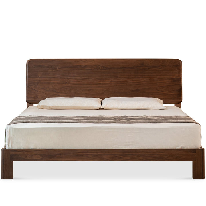 Japandi walnut wood bed dune in white background.