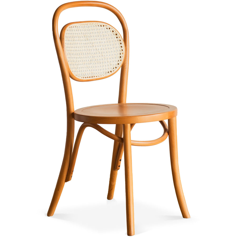 Scandinavian rattan dining chair german in white background.