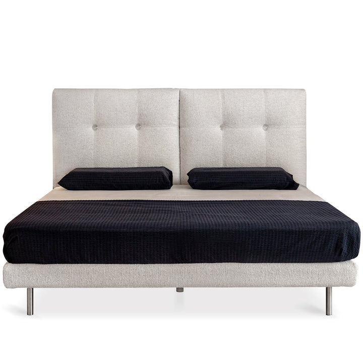 Minimalist boucle fabric bed morn in still life.
