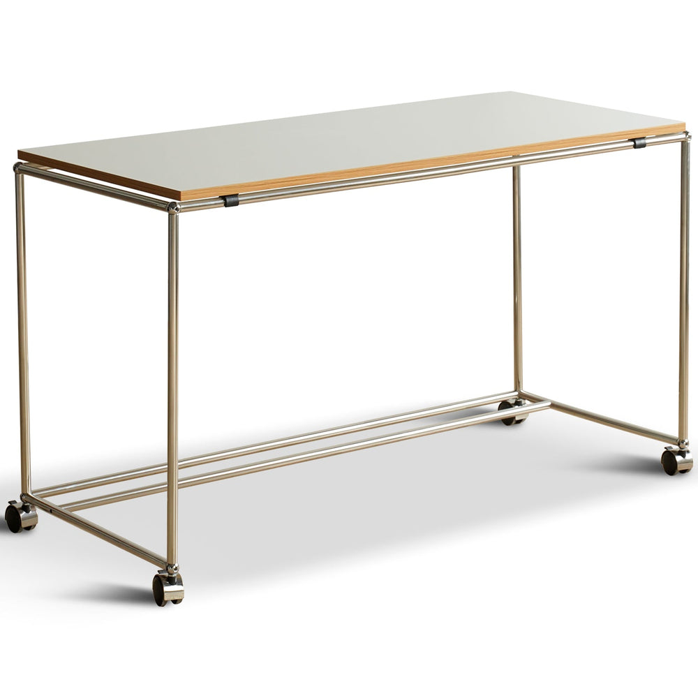 Bauhaus steel wheeled study table usm in white background.