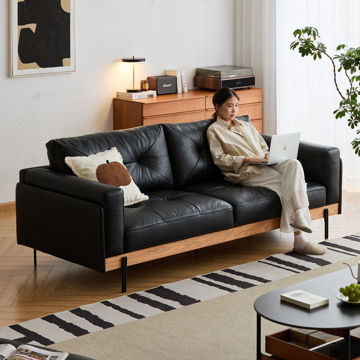 Bauhaus microfiber leather 4 seater sofa black in real life style.