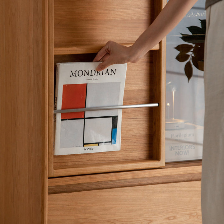 Scandinavian cherry wood side cabinet vista in close up details.