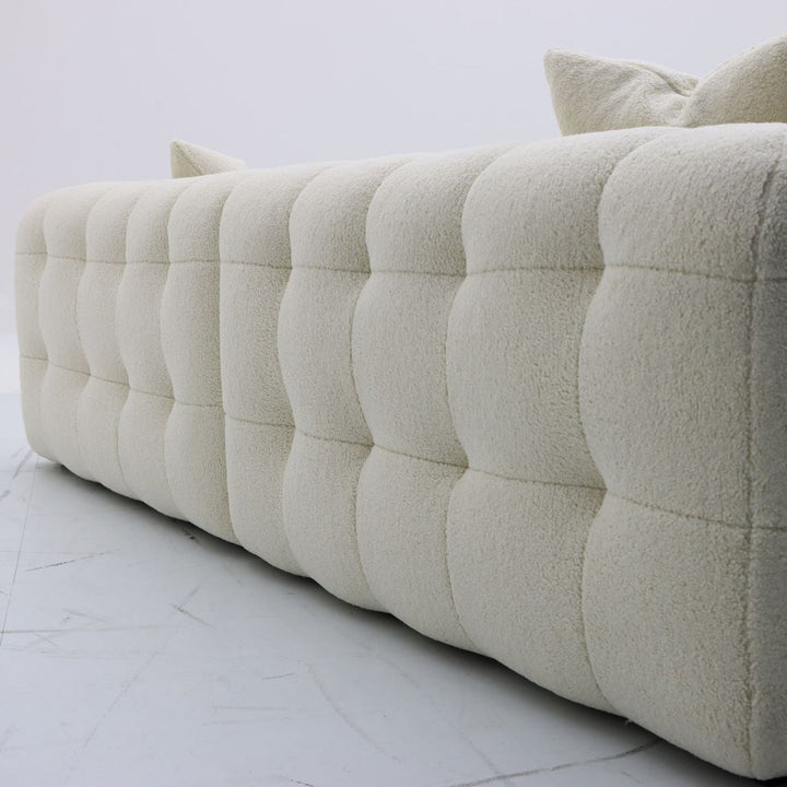 Cream boucle fabric 4 seater sofa boba in panoramic view.