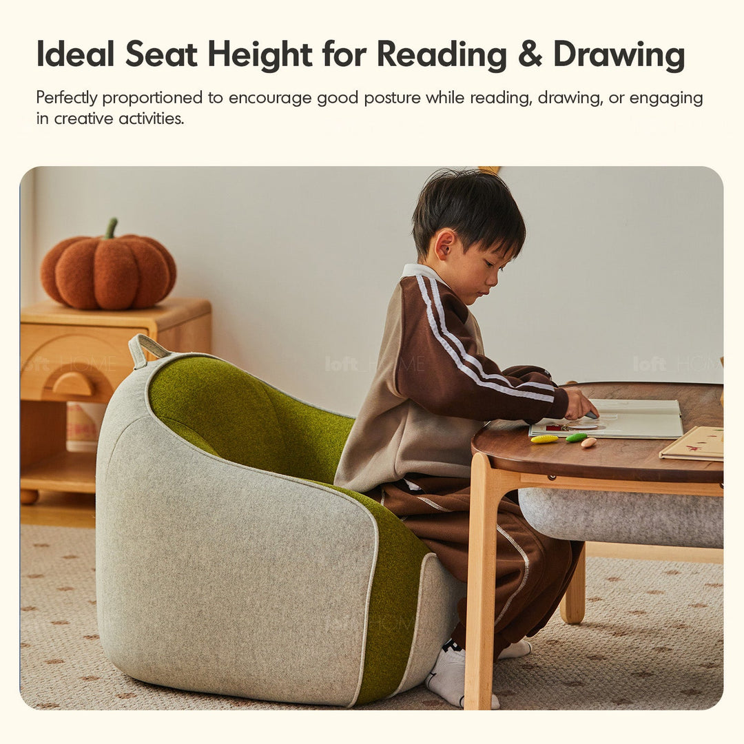 Bauhaus wool fabric kids 1 seater sofa avocado in close up details.