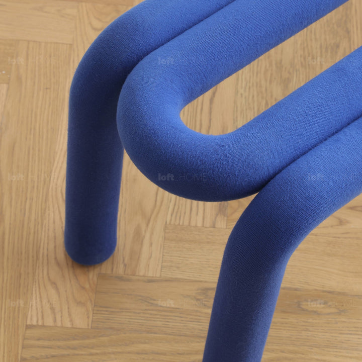 Contemporary velvet fabric dining bench bold in panoramic view.