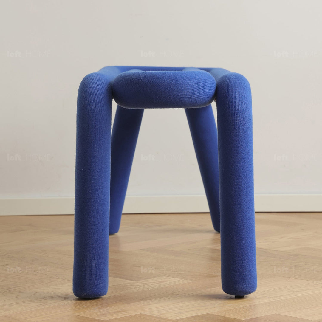 Contemporary velvet fabric dining bench bold in still life.