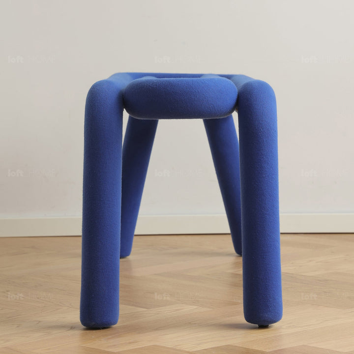 Contemporary velvet fabric dining bench bold in still life.