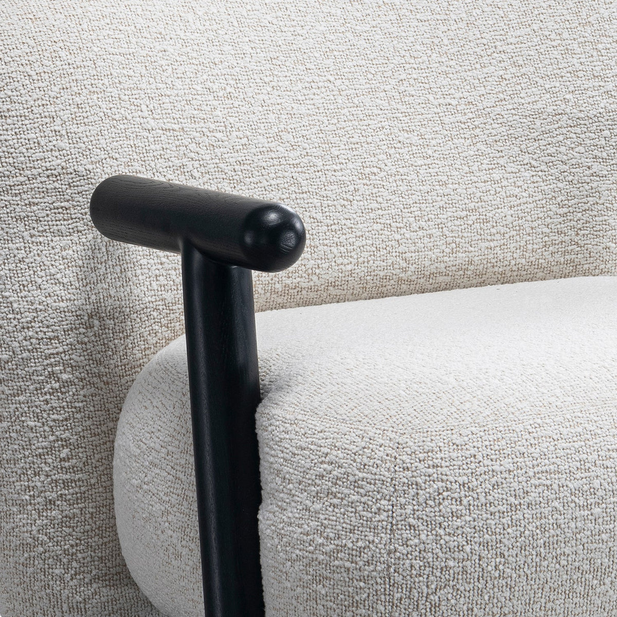 Cream boucle fabric 1 seater sofa with armrest malt with context.