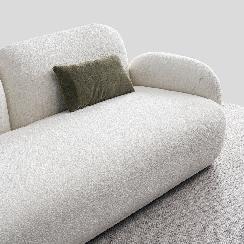Cream boucle fabric 3 seater sofa pluum in real life style.