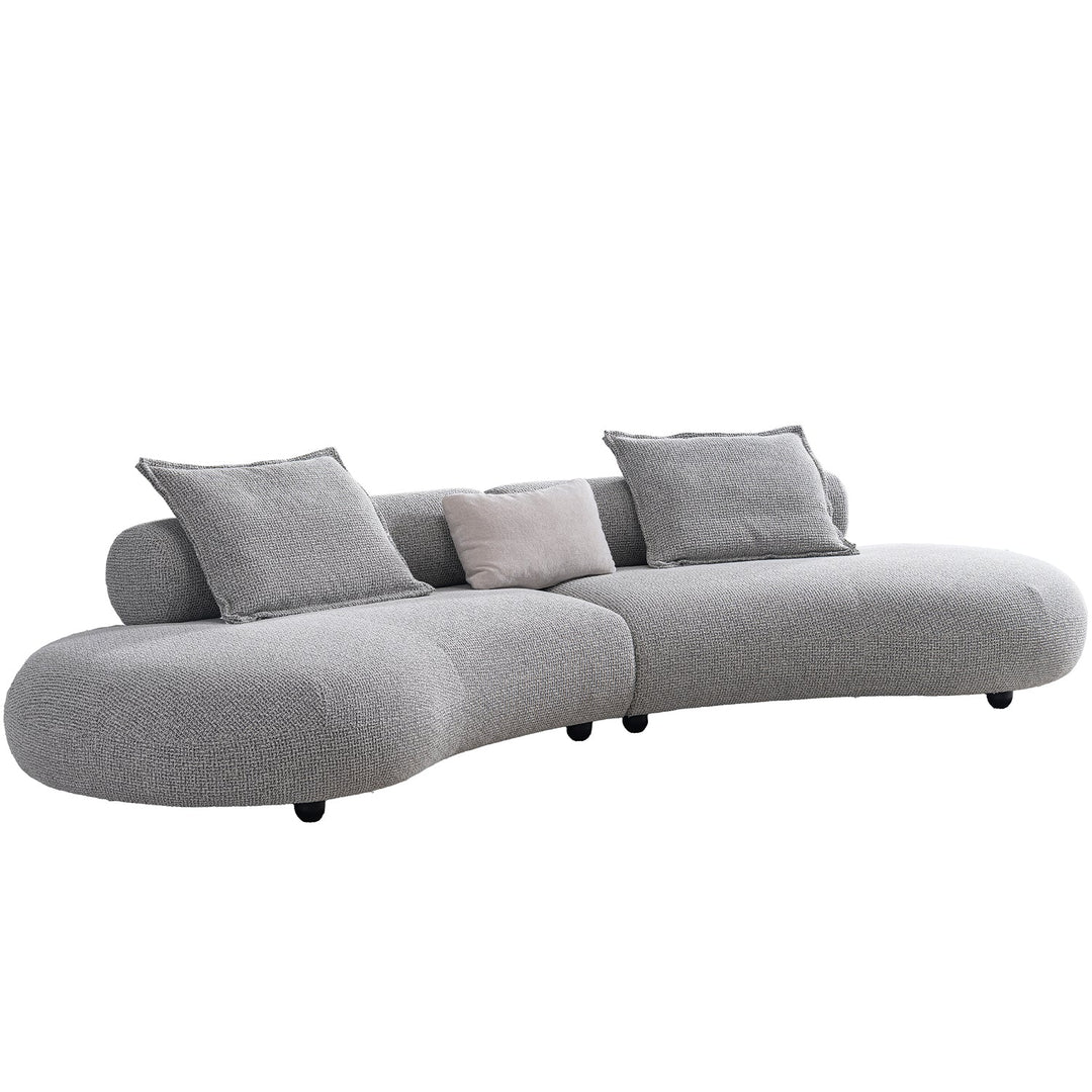 Cream mixed weave fabric 6 seater sofa curvo in real life style.