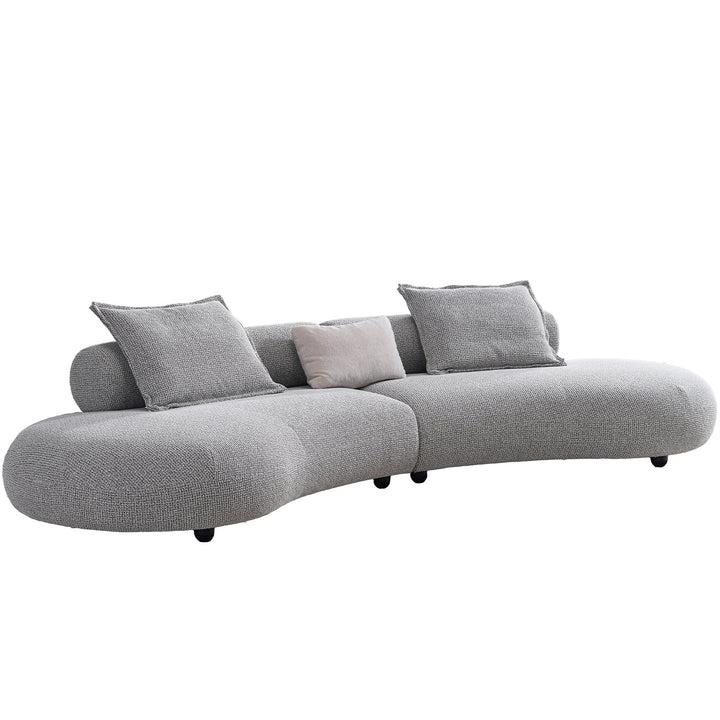 Cream mixed weave fabric 6 seater sofa curvo in real life style.