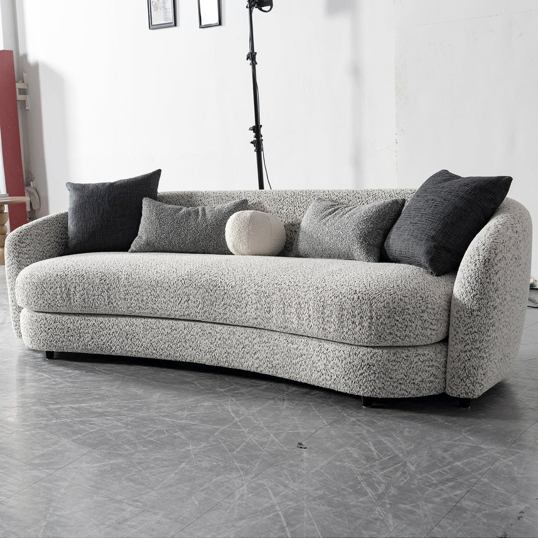 Cream boucle fabric 4 seater sofa nova in panoramic view.