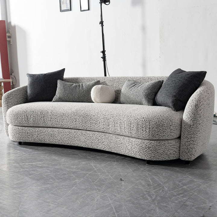 Cream boucle fabric 4 seater sofa nova in panoramic view.