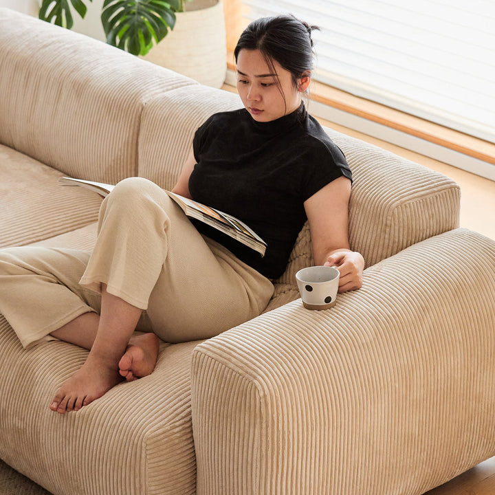 Cream corduroy velvet fabric 4 seater sofa square layered structure.