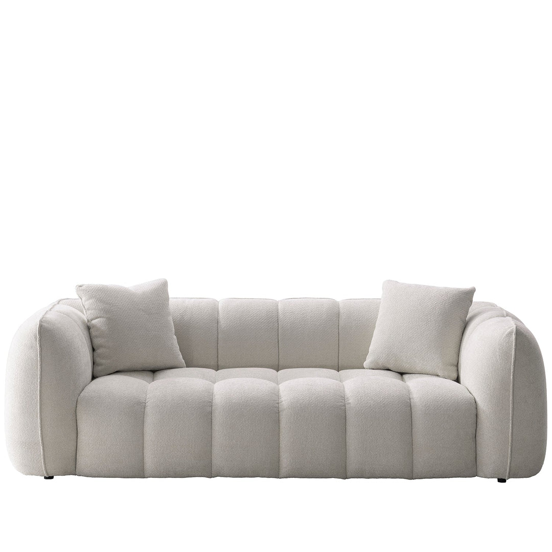 Cream mixed weave fabric 3 seater sofa puddy in white background.