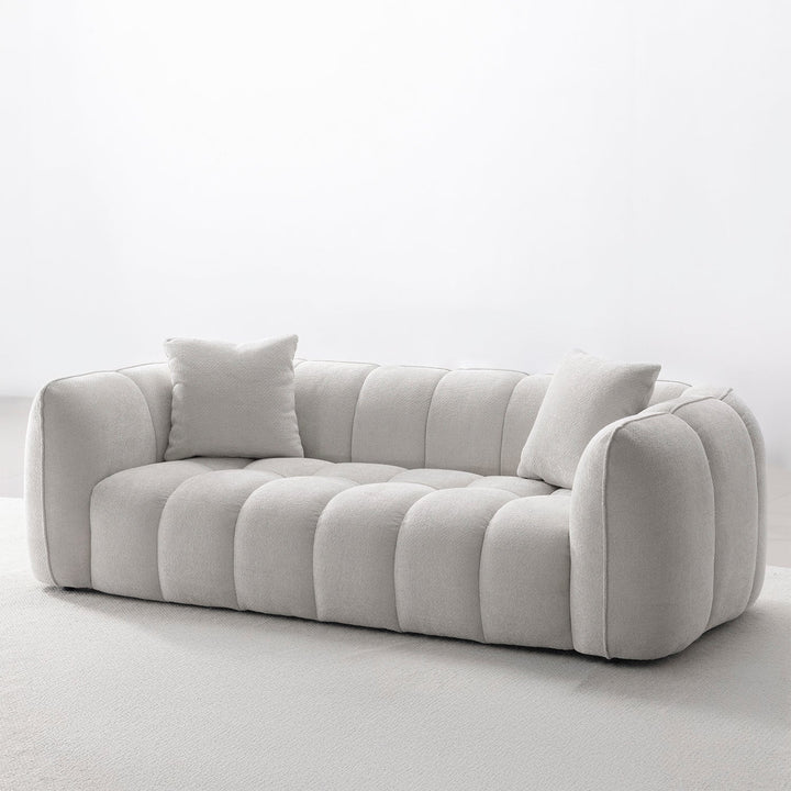 Cream mixed weave fabric 3 seater sofa puddy in real life style.