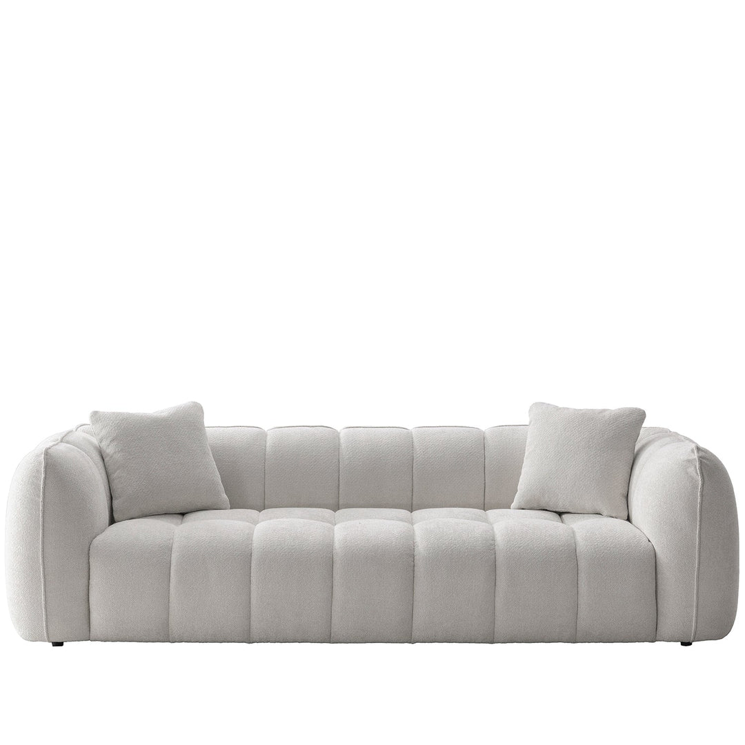 Cream mixed weave fabric 4 seater sofa puddy in white background.