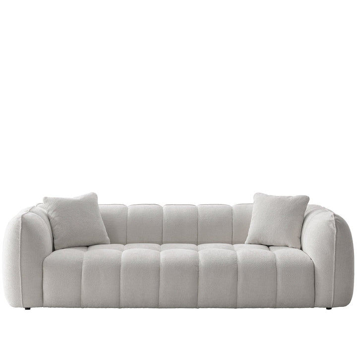 Cream mixed weave fabric 4 seater sofa puddy in white background.